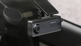 A dashcam in a car window